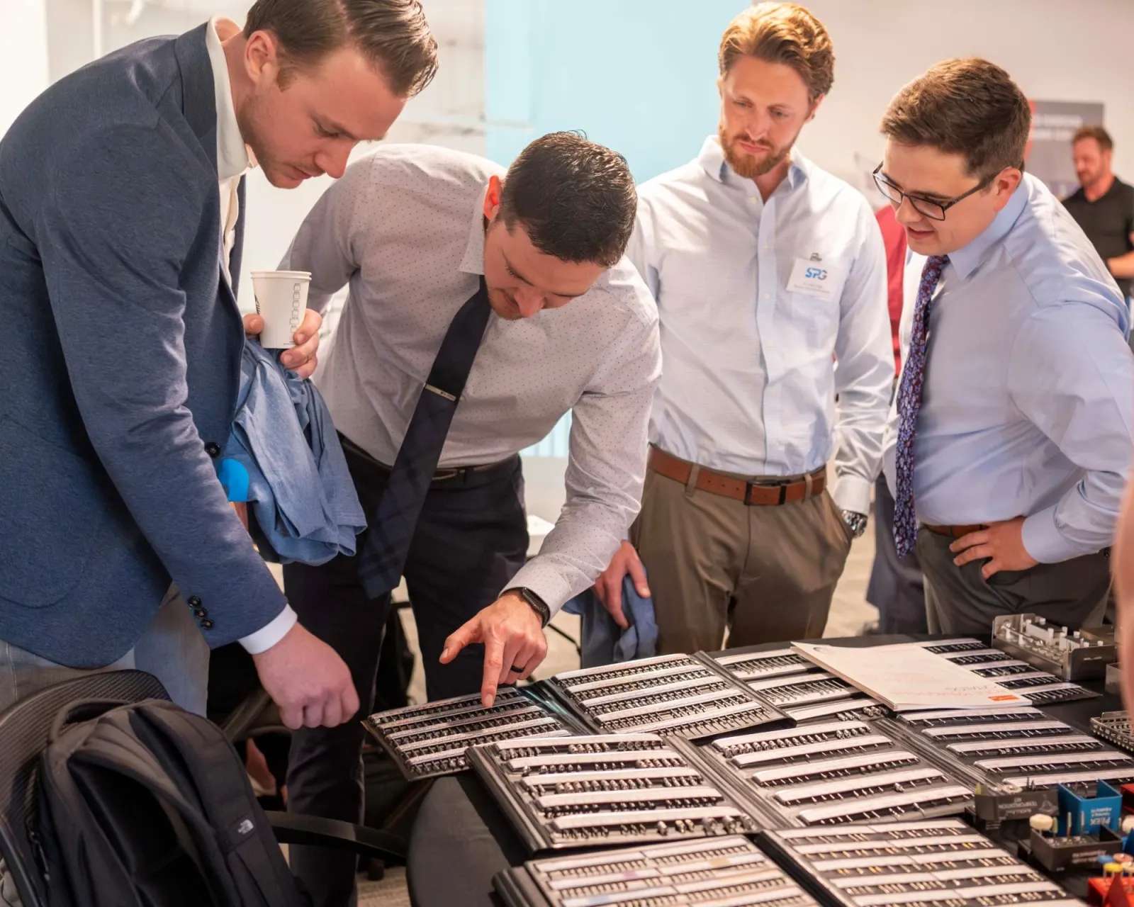 SPG doctors looking over implant instrument kits
